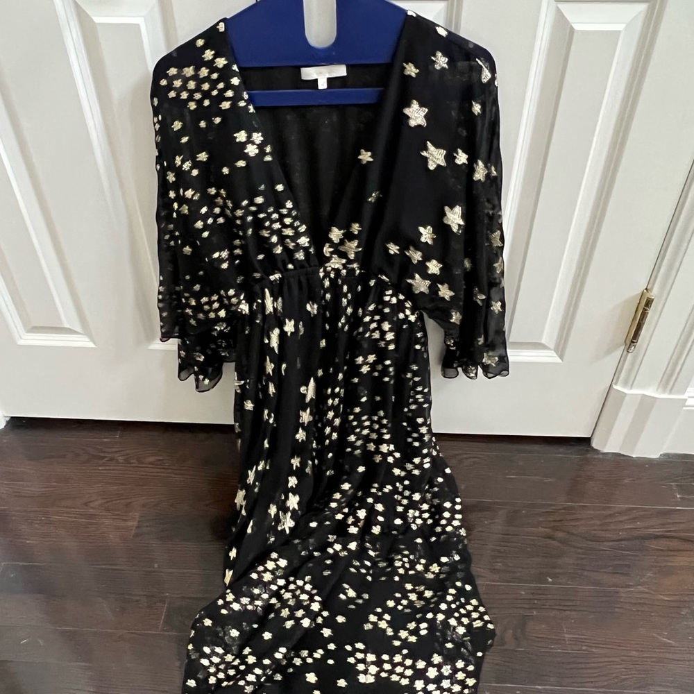 Gorgeous LOVE SHACK FANCY dress. It’s midi length.